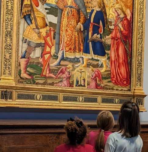 children admiring a painting